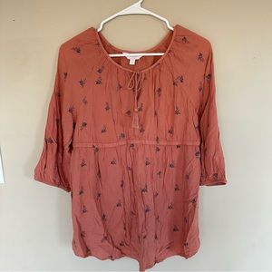 A glow peach maternity blouse